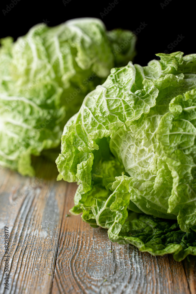 Macro photo of iceberg cabbage leaves and fresh green crown, close up Macro photo of iceberg cabbage leaves and fresh green crown, close up