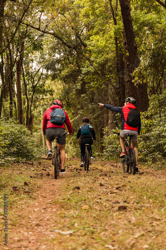 Bikers in the jungle. Bikers exercise outdoors. Concept of sport and outdoors.