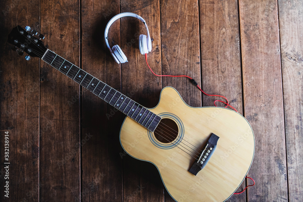 Fototapeta premium Classical guitar and music headphones