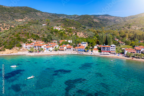 Aerial view of the little fishing village Platanias, South Pelion, Greece, with turquoise sea and red roofed houses