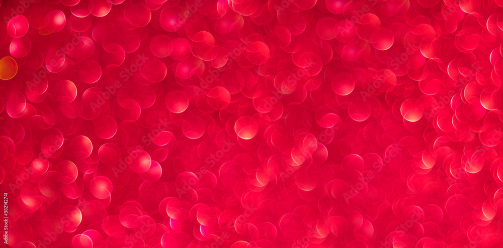 Red bokeh holiday textured glitter background. Blurred abstract holiday background. Banner Red bokeh holiday textured glitter background. Blurred abstract holiday background. Banner