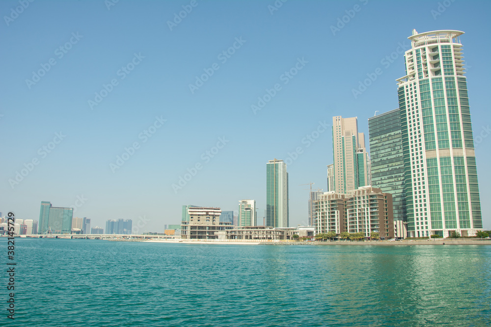 Abu Dhabi skyline seen from the Corniche on the Persian Gulf in United Arab Emirates
