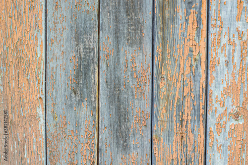 Old wooden flooring with pink, peeling paint. © Visionlabs