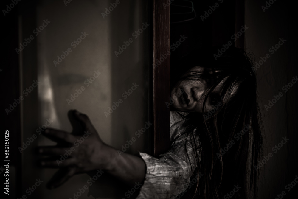 Portrait of asian woman make up ghost face with blood,Horror scene,Scary background,Halloween poster,Thailand people,Ghost movies poster Portrait of asian woman make up ghost face with blood,Horror scene,Scary background,Halloween poster,Thailand people,Ghost movies poster