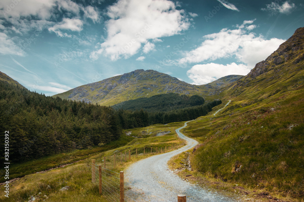 Path in mountains of scotland, blue sky