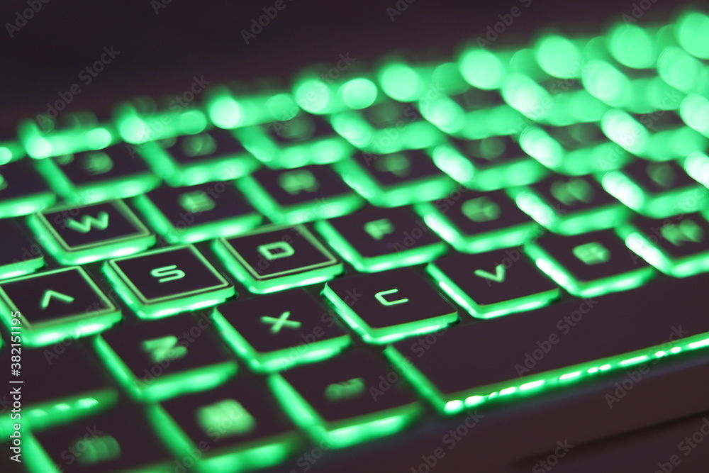 computer keyboard with green key