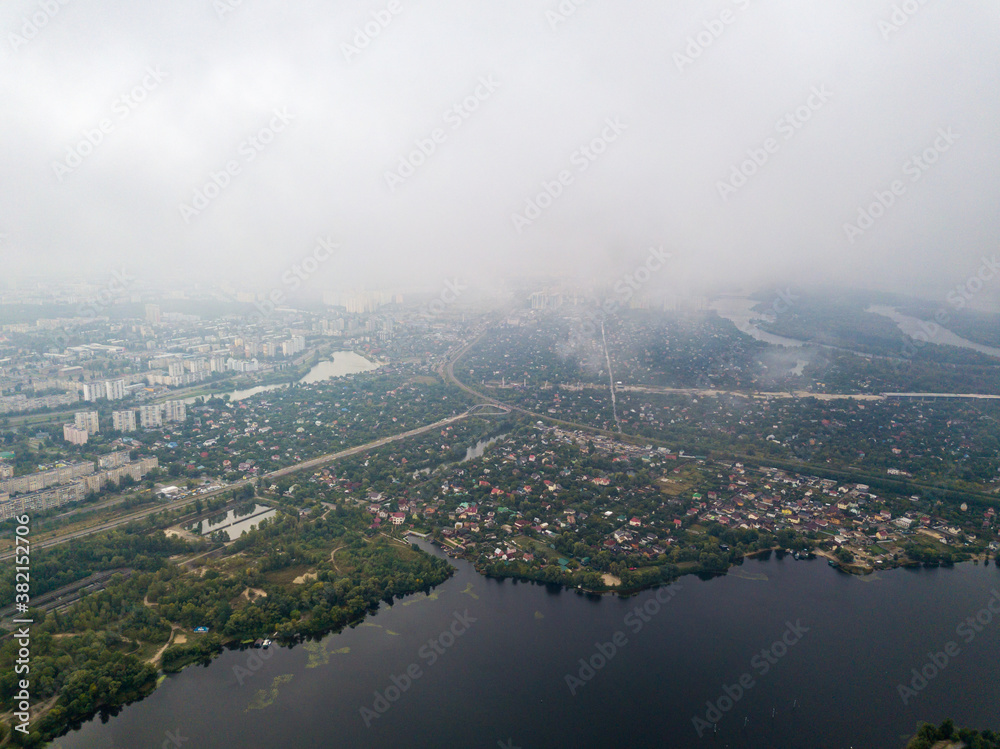High aerial view of Kiev and the Dnieper river from under the clouds.