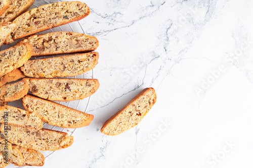 Fresh biscotti cookies on the white marble background with a copy space