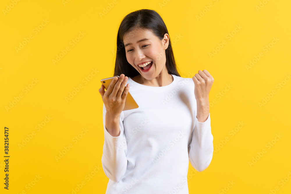 Beautiful young woman surprised facial expression after seeing shocking, amaze deal isolated on yellow background. Studio shot. Beautiful young woman surprised facial expression after seeing shocking, amaze deal isolated on yellow background. Studio shot.