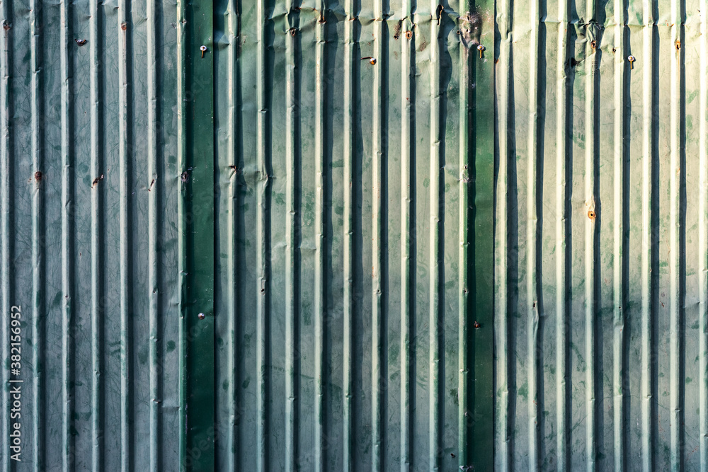 Old metal rusty zinc texture sheet roof texture with lighting. Abstract background. Old metal rusty zinc texture sheet roof texture with lighting. Abstract background.