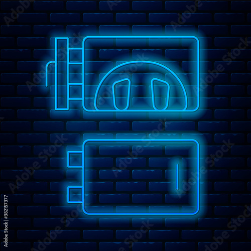 Glowing neon line Crematorium icon isolated on brick wall background. Vector.