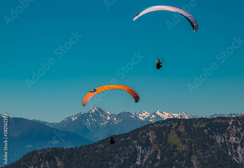 Beautiful alpine view with paragliders at the famous Rofan summit, Maurach, Achensee, Pertisau, Tyrol, Austria