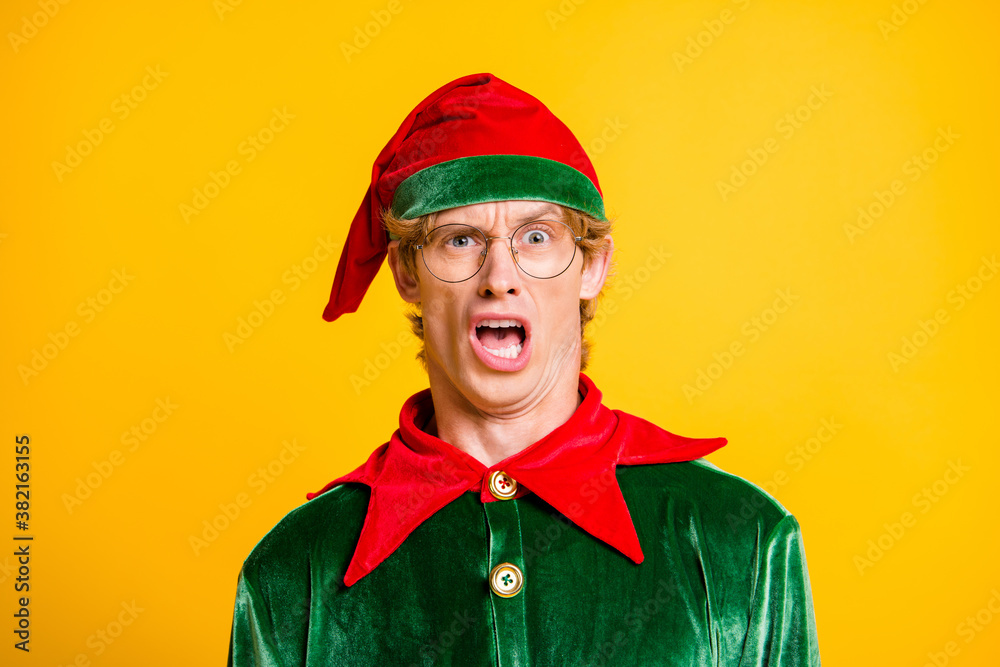 Close-up portrait of his he nice attractive emotional funny guy elf Eve Noel newyear party bad mood news reaction isolated over bright vivid shine vibrant yellow color background Close-up portrait of his he nice attractive emotional funny guy elf Eve Noel newyear party bad mood news reaction isolated over bright vivid shine vibrant yellow color background
