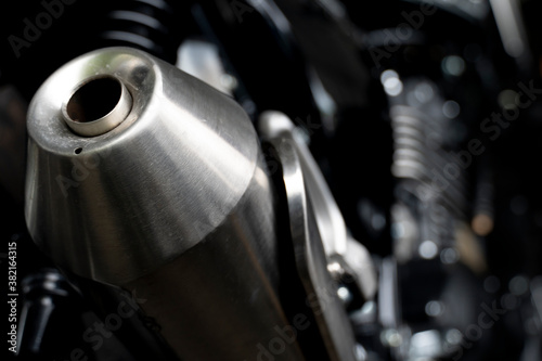 Abstract dark tone exhaust pipe of big motorcycle.