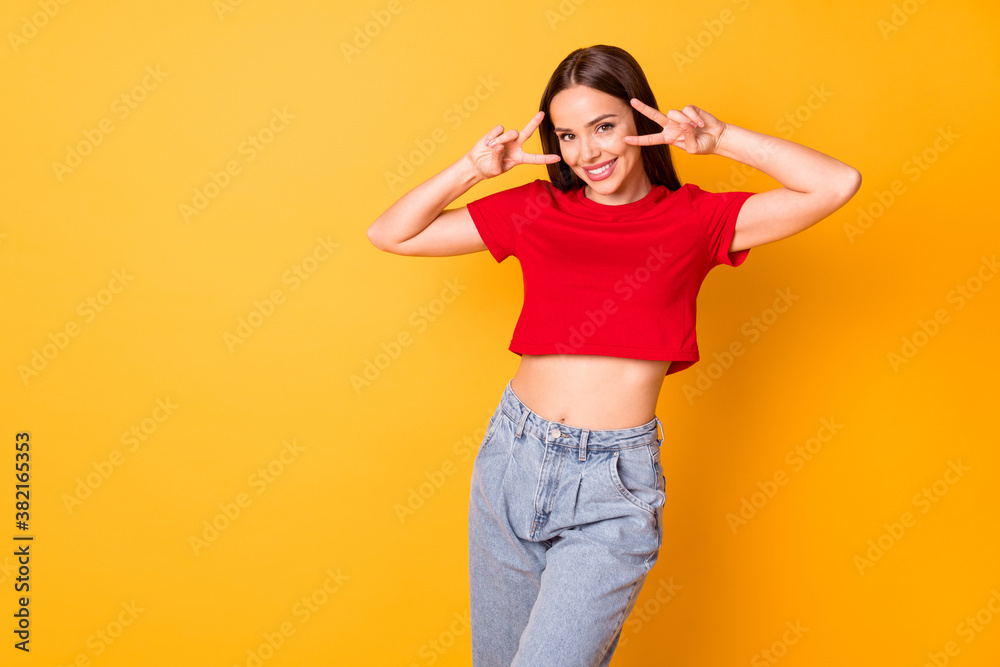 Photo of funny lady showing v-sign symbols near eyes wear casual red top denim isolated yellow color background Photo of funny lady showing v-sign symbols near eyes wear casual red top denim isolated yellow color background