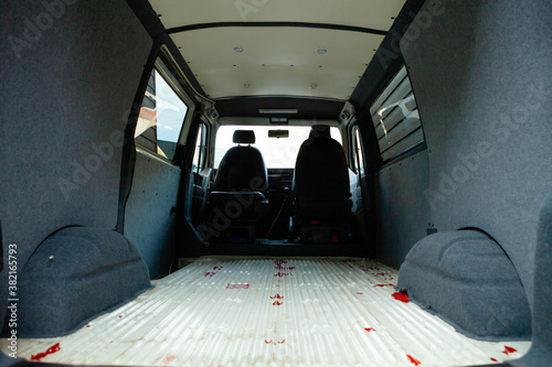 Conversion of a t4 van into a camper van.. Carpeting has been added over the soundproofing and insulation