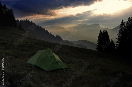 Tent on an alpine meadow in Obwalden, Switzerland.