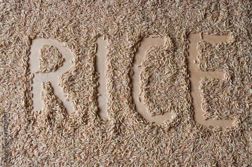 word rice on a brown rice background