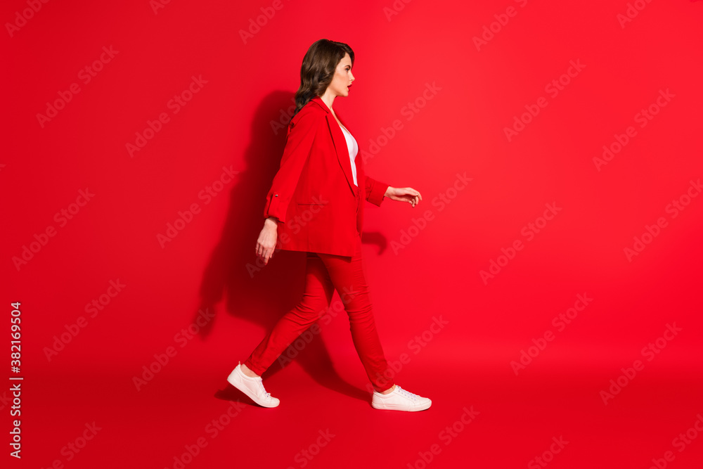 Full length profile side photo of gorgeous dream lady go empty space isolated over bright red color background