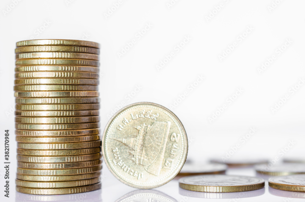 gold coin stack row growing pile on white background for money saving and investment business financial and banking concept. gold coin stack row growing pile on white background for money saving and investment business financial and banking concept.