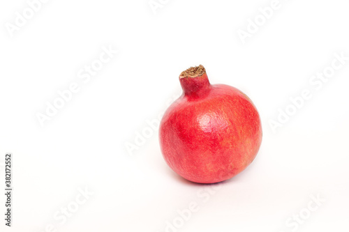 red pomegranate on white background