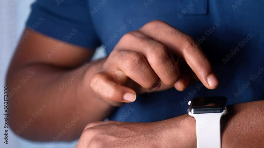 top view of man's hand using smart watch. top view of man's hand using smart watch.