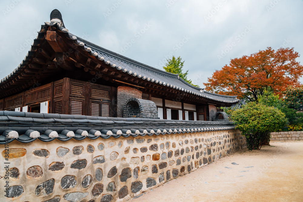 Korean traditional house with autumn maple leaves at Namsangol Hanok Village in Seoul, Korea