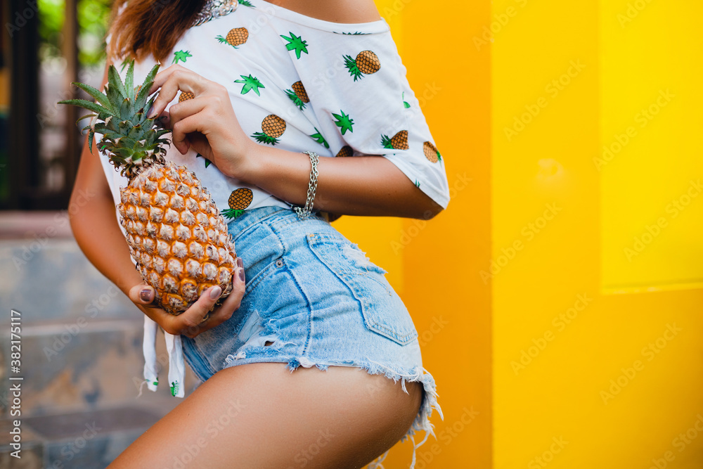 booty and hips in jeans shorts of attractive woman on summer vacation