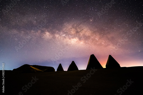 Pyramids in Sudan at Night with milky way starry background photo