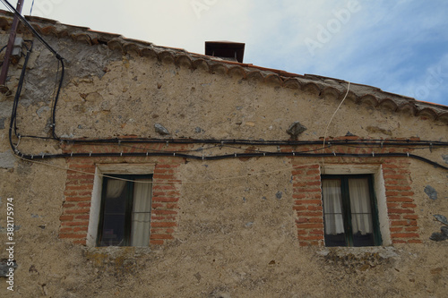Two old small windows in a village