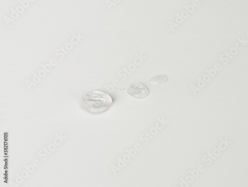 COVID PPE Hand Sanitizer Drops on White Background