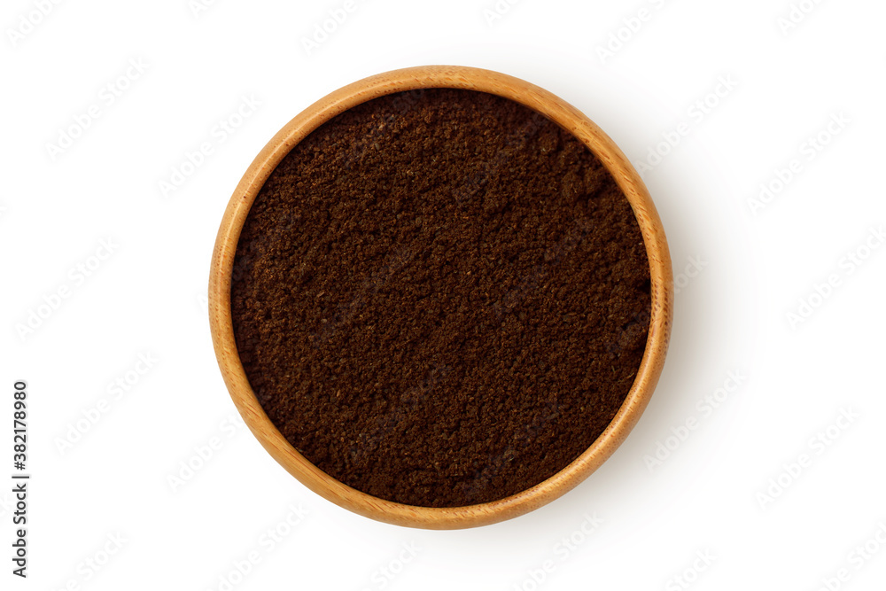 Coffee powder in wooden bowl on white background Coffee powder in wooden bowl on white background