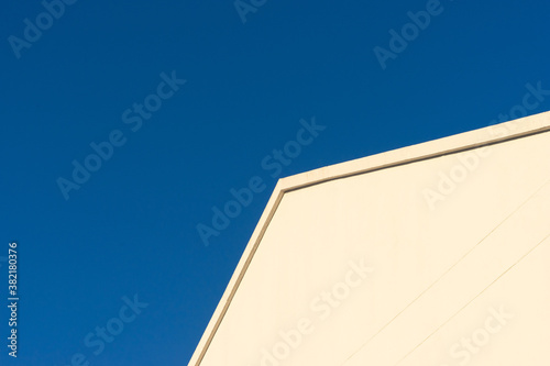 Geometry design bulding roof corner with clear blue sky background.