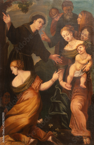 ARCO, ITALY - JUNE 8, 2018: The painting of scene as St. Anthony of Padua reattaches the young man's foot in the church Collegiata dell'Assunta by unknown artist.