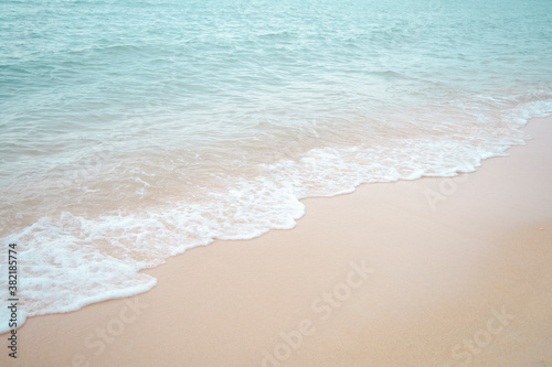 The waves hit a beautiful beach on one of the islands of Thailand.