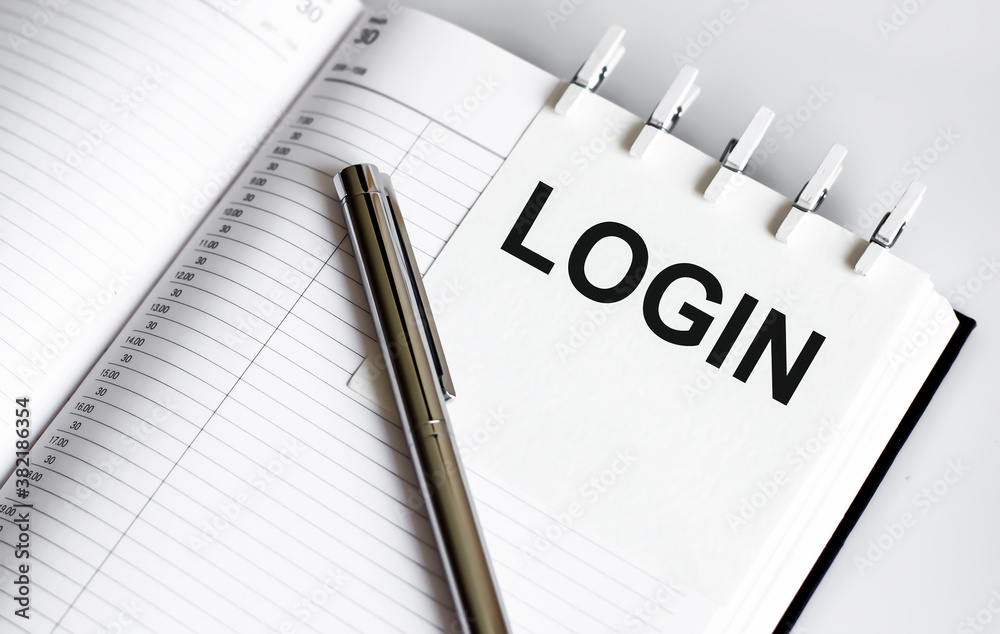 text LOGIN on the short note texture background with pen text LOGIN on the short note texture background with pen
