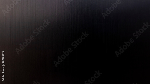Abstraction Dark metallic background. Dark brushed metal aluminum background and texture with highlights.