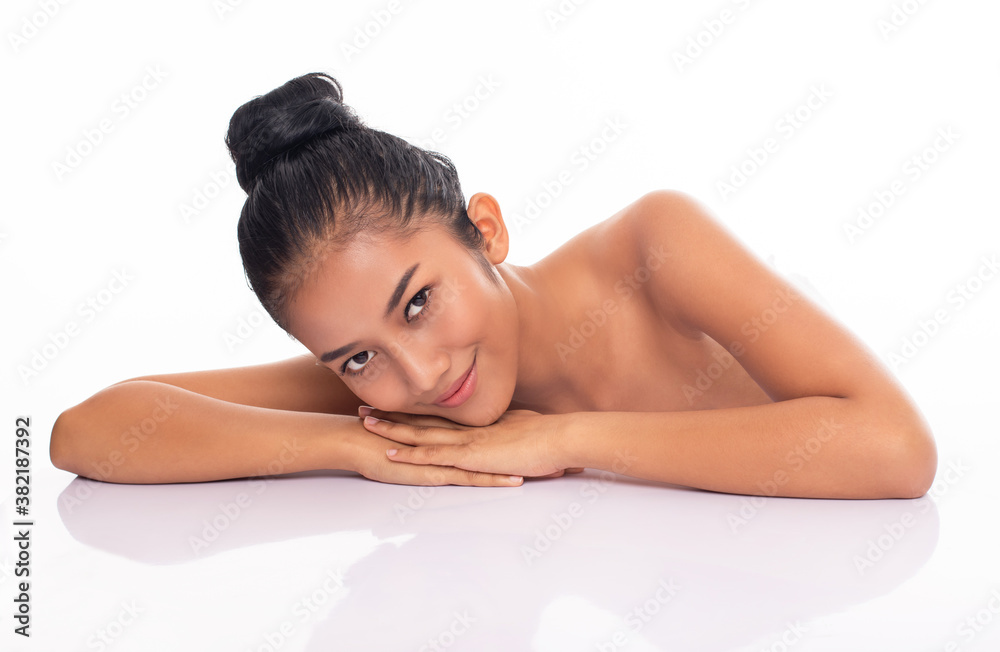 Beauty portrait of asian female face with natural tan skin isolated. Beautiful asia woman face looking at camera close up studio on white background. Beauty portrait of asian female face with natural tan skin isolated. Beautiful asia woman face looking at camera close up studio on white background.