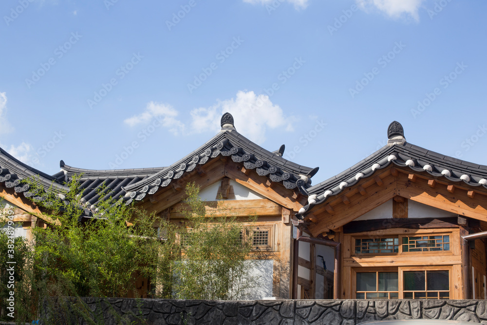 The eaves of Korean traditional houses on the blue sky background.
