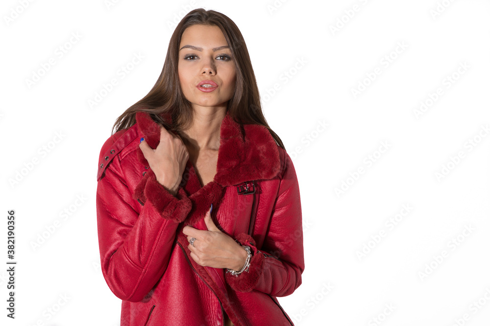 portrait of a girl in a red jacket studio white background