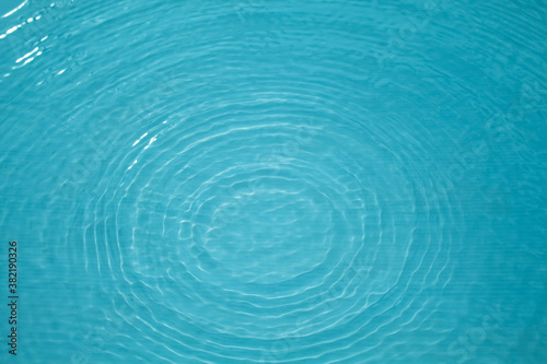 Top view Closeup blue water rings, Circle reflections in pool.