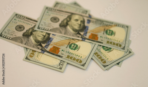 Stacks of paper 100 dollars USA on the white background