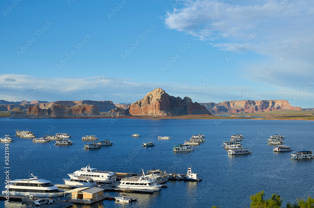 Lake Powell with boats and mountains in the background