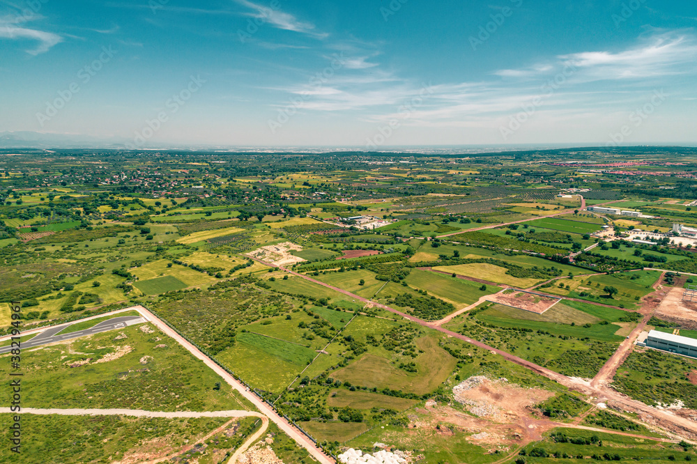 Aerial top view photo of agricultural areas near the city center