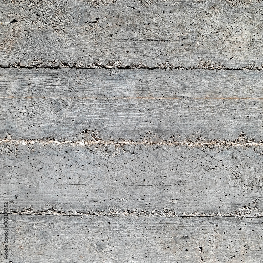 grey concrete wall closeup with wooden planks pattern imprint, seamless background grey concrete wall closeup with wooden planks pattern imprint, seamless background