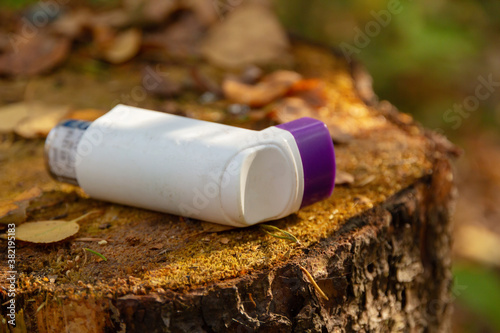 Inhaler on a tree stump