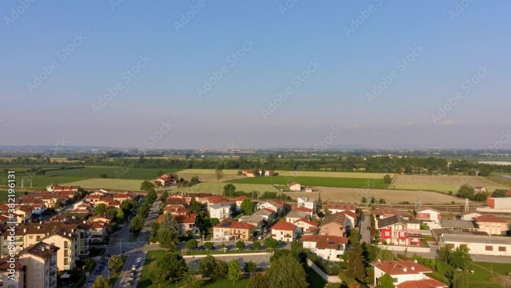 Drone Aerial Ascends over City Rooftops to reveal amazing Farms and Meadows as far as the eye can see Drone Aerial Ascends over City Rooftops to reveal amazing Farms and Meadows as far as the eye can see