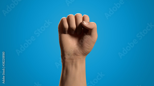 fist on A.I. blue background