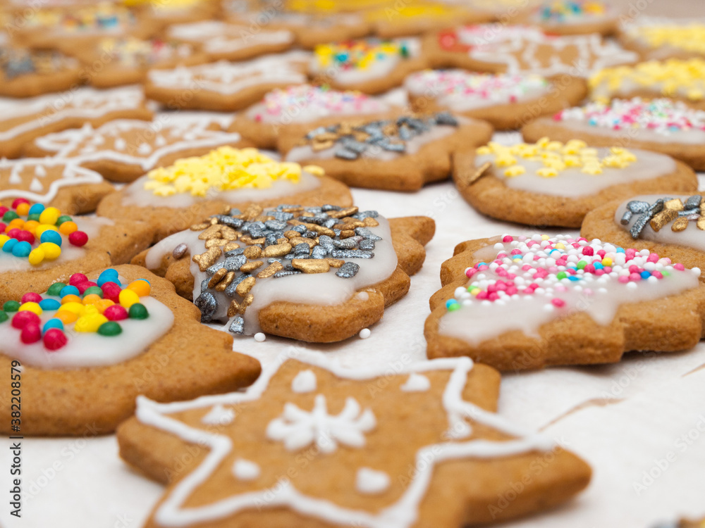 Christmas gingerbread cookies with icing and colorful sprinkles
