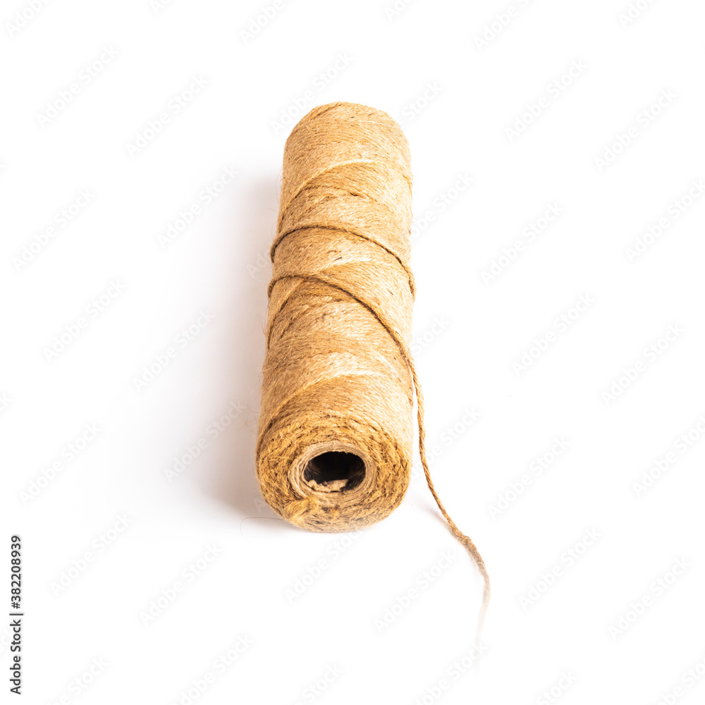 flax rope. Twine made from natural raw materials. On white background. Close-up. flax rope. Twine made from natural raw materials. On white background. Close-up.